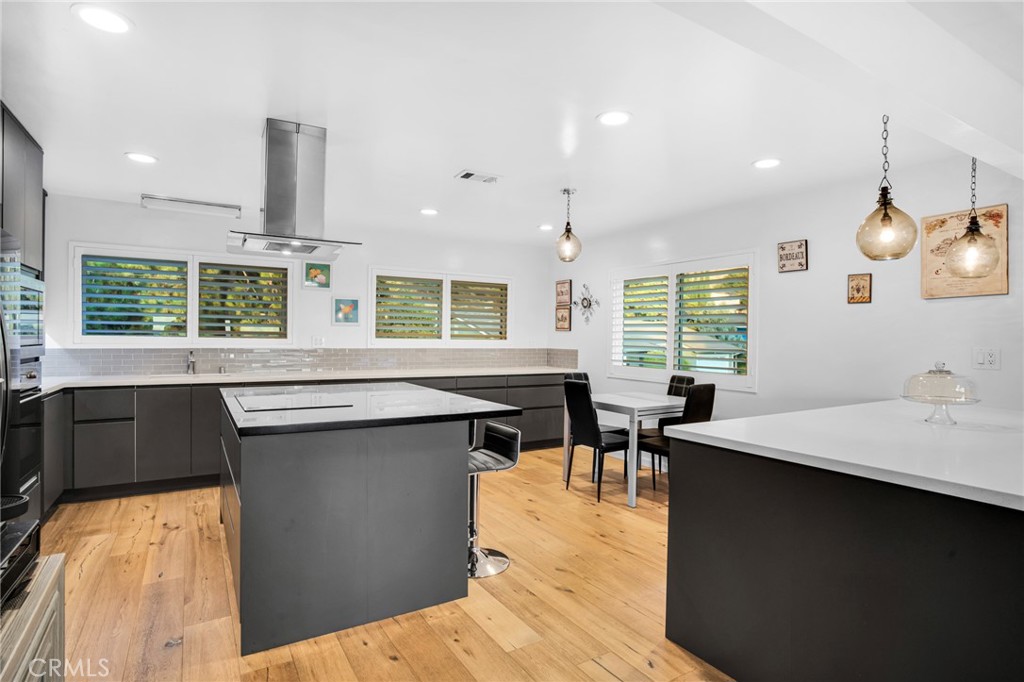 10208 Sully Drive Sun Valley, CA 91352 - Photo 15 of 44 a kitchen with a table and chairs in it