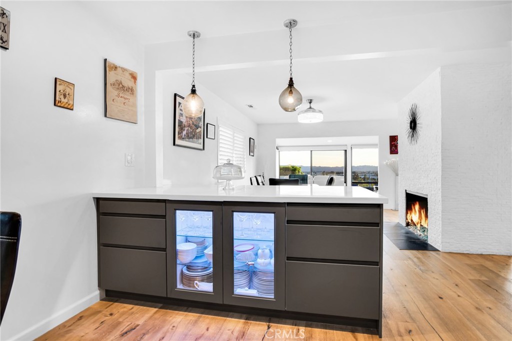10208 Sully Drive Sun Valley, CA 91352 - Photo 18 of 44 a kitchen with stainless steel appliances granite countertop a sink a stove and a wooden floors