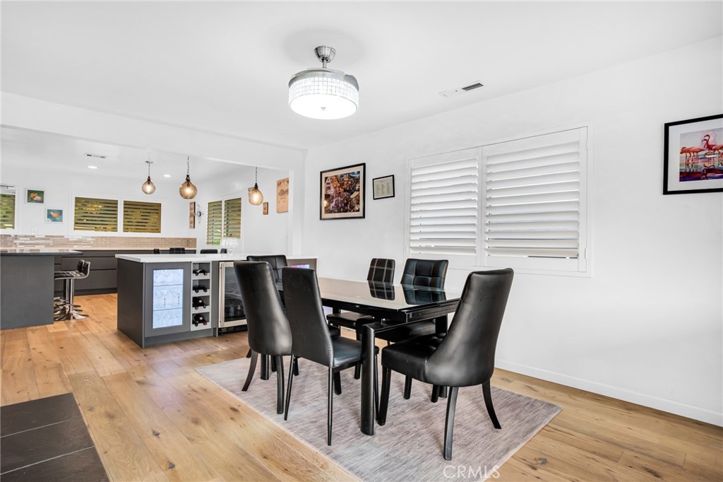 10208 Sully Drive Sun Valley, CA 91352 - Photo 20 of 44 a view of a dining room with furniture and wooden floor