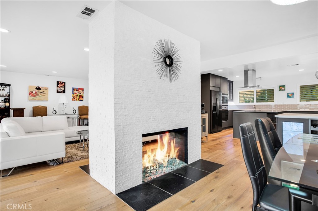 10208 Sully Drive Sun Valley, CA 91352 - Photo 21 of 44 a living room with stainless steel appliances furniture a rug and a kitchen view