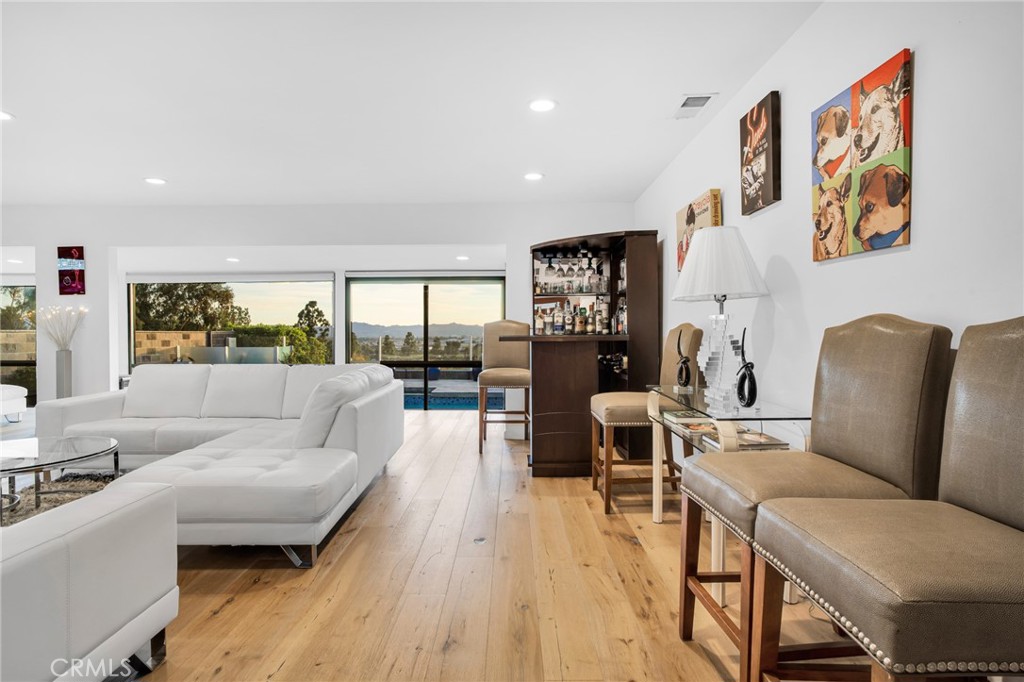 10208 Sully Drive Sun Valley, CA 91352 - Photo 25 of 44 a living room with furniture and a wooden floor