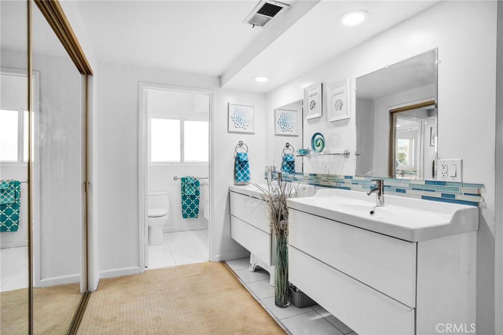 10208 Sully Drive Sun Valley, CA 91352 - Photo 29 of 44 a bathroom with a sink and a mirror