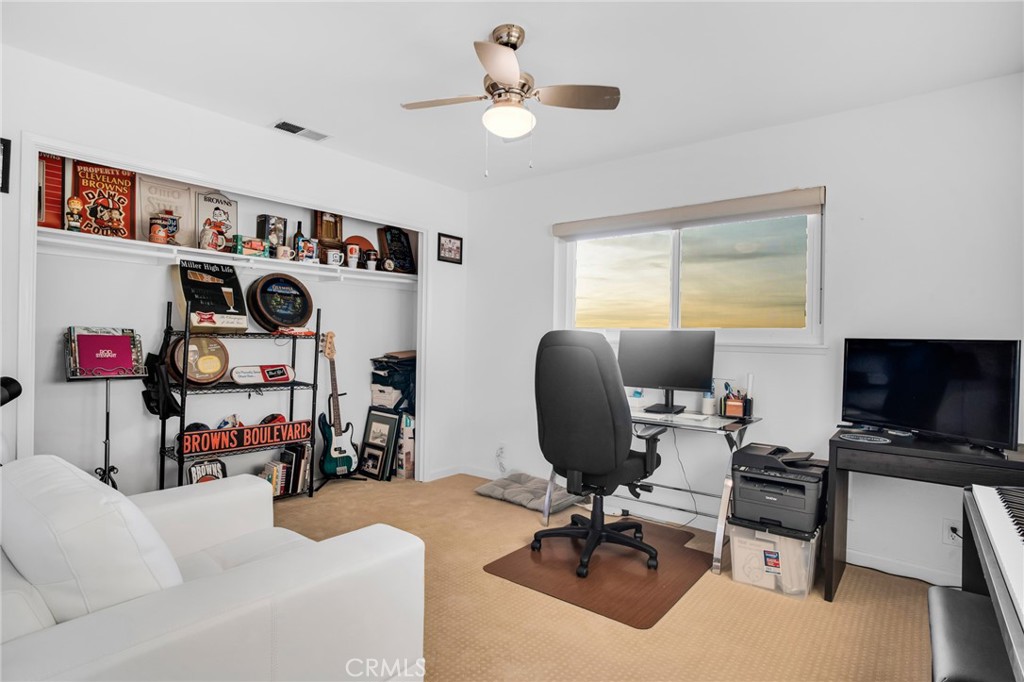 10208 Sully Drive Sun Valley, CA 91352 - Photo 31 of 44 a view of a workspace with furniture and a window