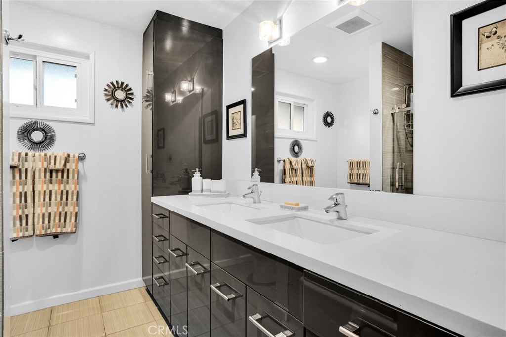 10208 Sully Drive Sun Valley, CA 91352 - Photo 34 of 44 a bathroom with a sink and a mirror
