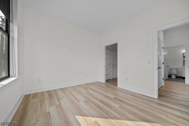 1 Union Avenue, Unit 207 Cresskill, NJ 07626 - Photo 33 of 49 a view of an empty room and wooden floor