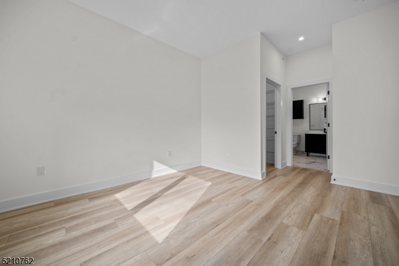 1 Union Avenue, Unit 207 Cresskill, NJ 07626 - Photo 35 of 49 a view of empty room with wooden floor and window