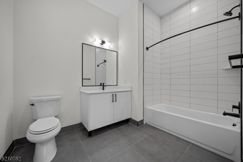 1 Union Avenue, Unit 207 Cresskill, NJ 07626 - Photo 42 of 49 a bathroom with a toilet a sink and bathtub