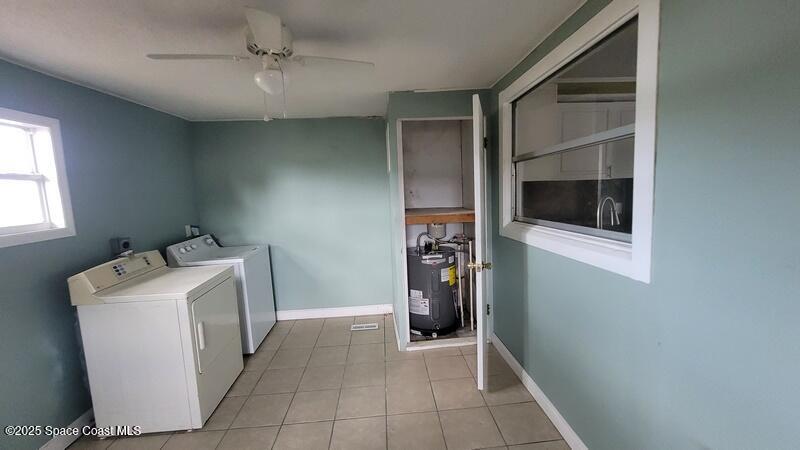 1666 Terrace Street Cocoa, FL 32922 - Photo 13 of 24 a utility room with dryer and washer