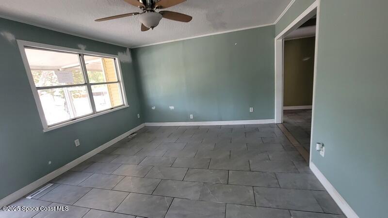 1666 Terrace Street Cocoa, FL 32922 - Photo 19 of 24 a view of an empty room with a window