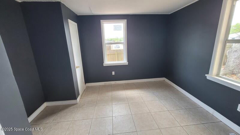 1666 Terrace Street Cocoa, FL 32922 - Photo 10 of 24 a view of an empty room with a window