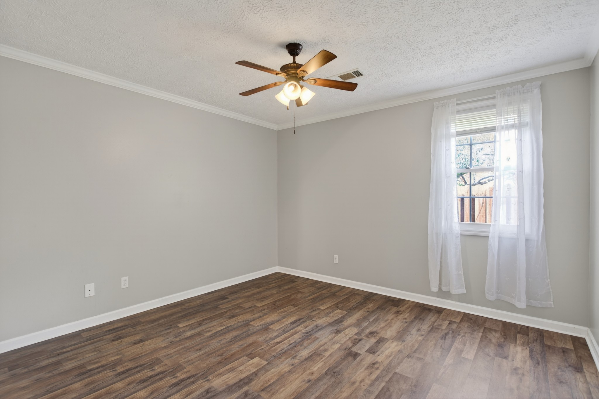 430 Walton Ferry Road, Unit 200 Hendersonville, TN 37075 - Photo 12 of 16 wooden floor in an empty room with a window
