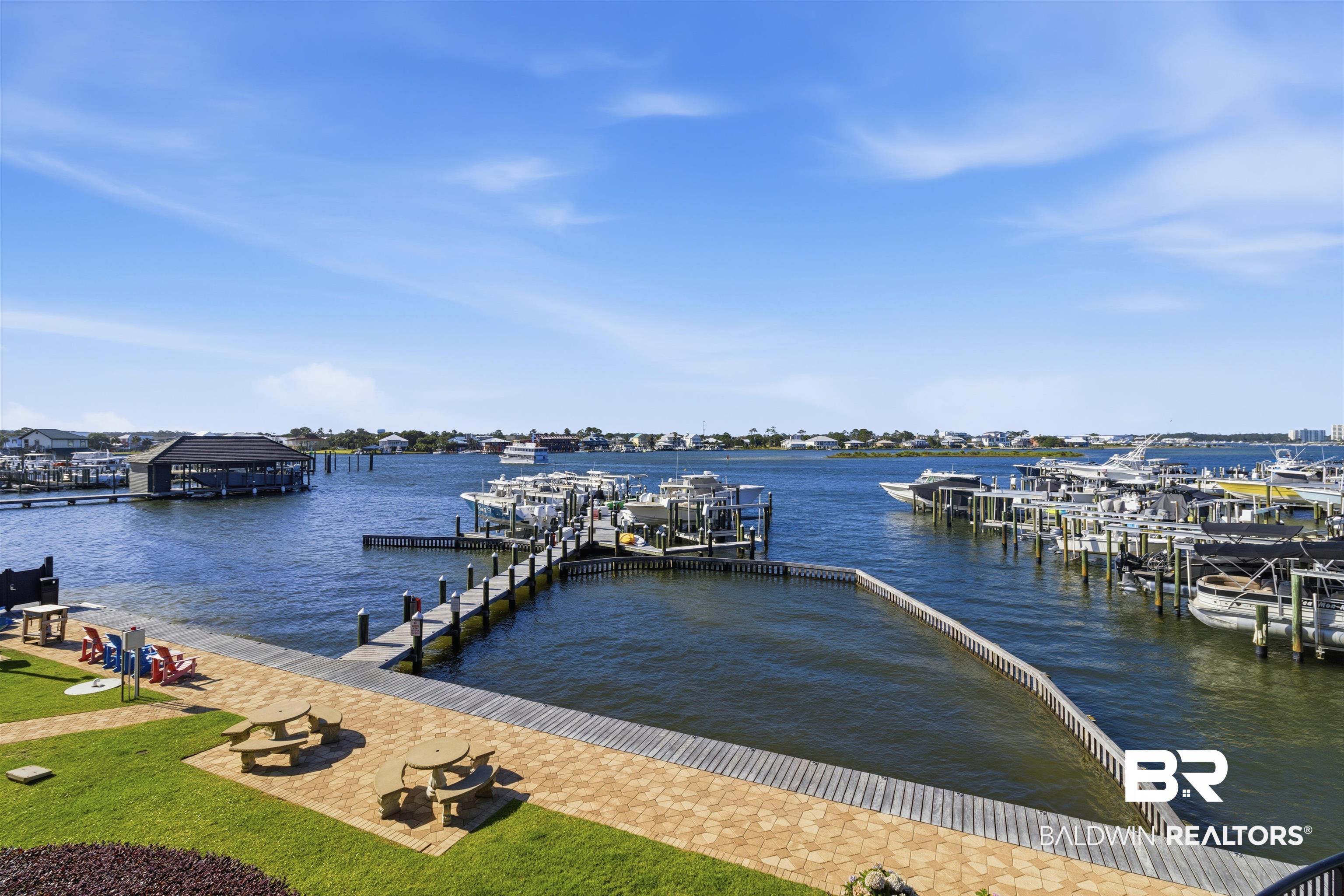 3564 Bayou Road, Unit 203 Orange Beach, AL 36561 - Photo 14 of 53 Waterfront property featuring a private boat slip, additional dock space, and a covered boat house