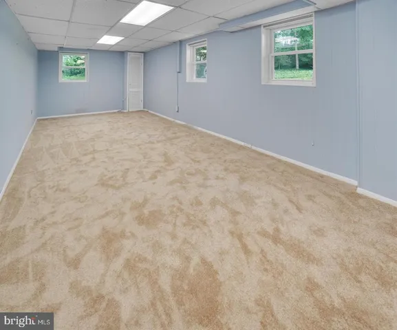 a view of empty room with windows