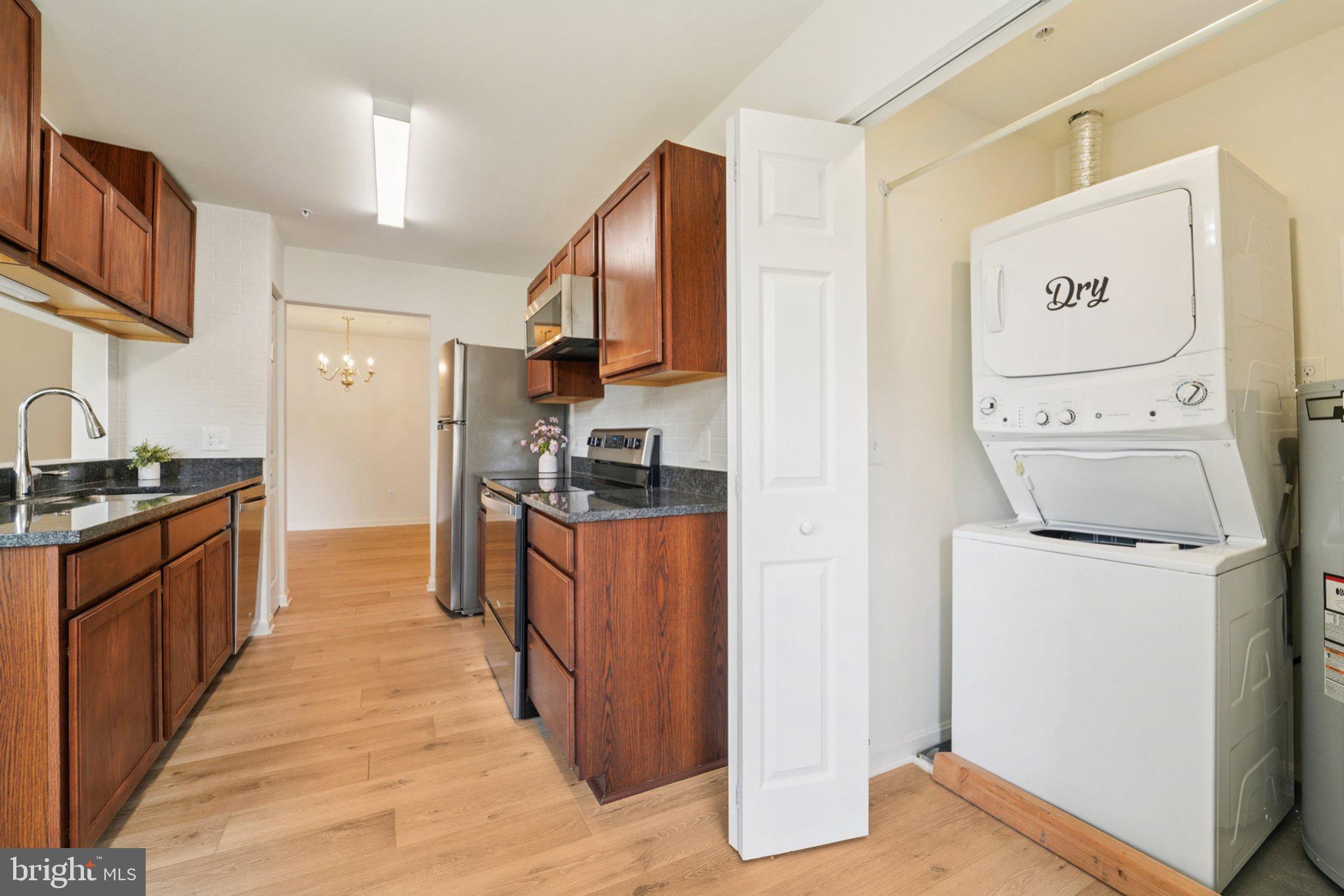 3500 Thomas Pointe Court, Unit 2B Abingdon, MD 21009 - Photo 13 of 37 a kitchen with stainless steel appliances a refrigerator and a stove top oven
