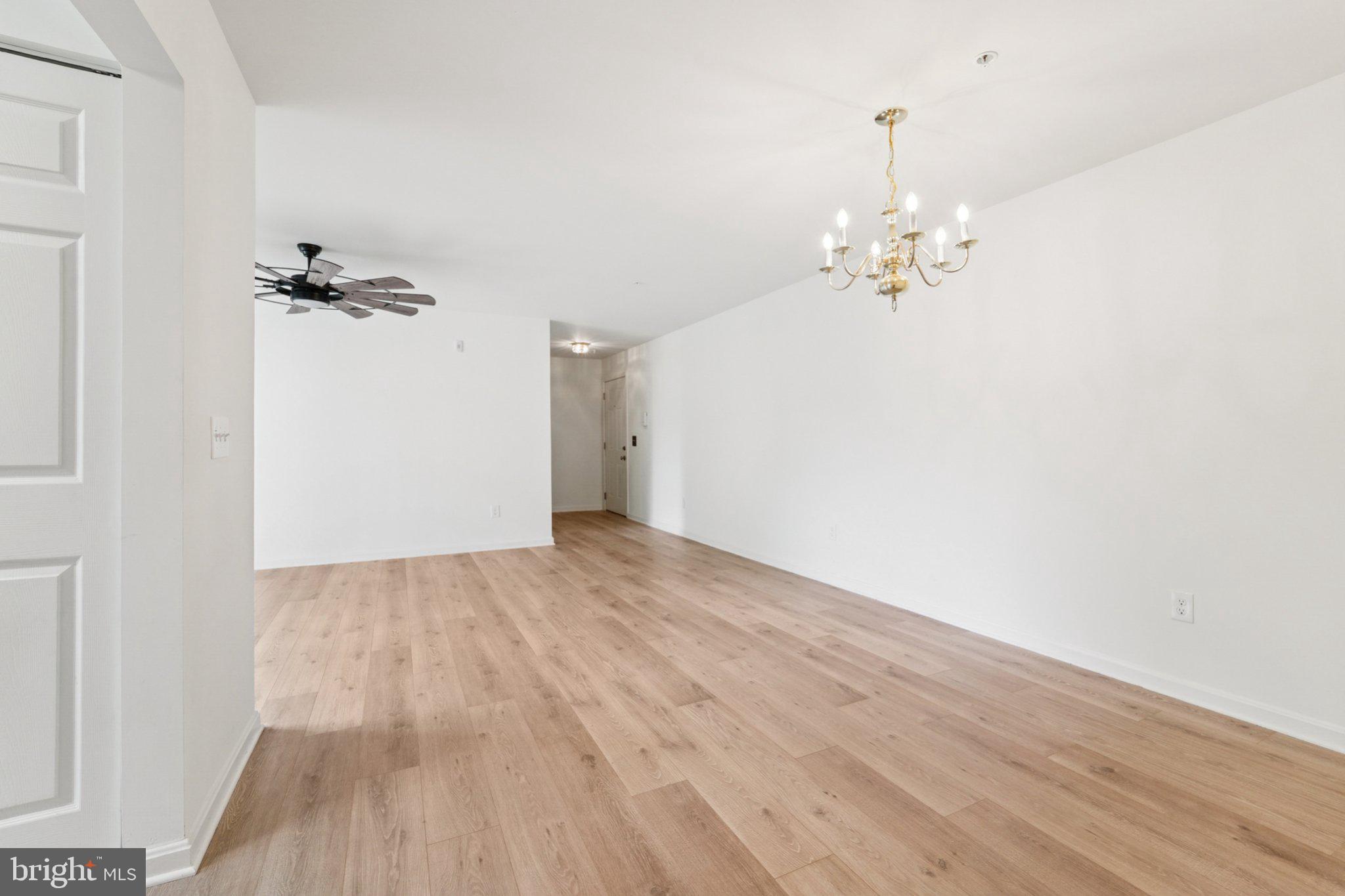 3500 Thomas Pointe Court, Unit 2B Abingdon, MD 21009 - Photo 16 of 37 wooden floor in an empty room with a window