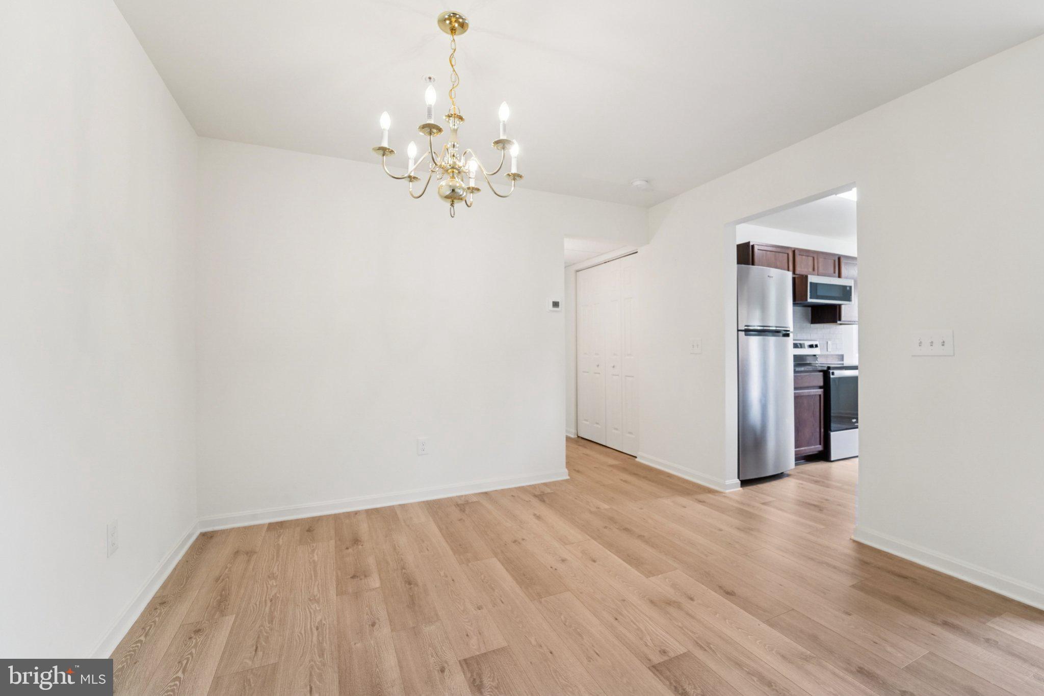 3500 Thomas Pointe Court, Unit 2B Abingdon, MD 21009 - Photo 17 of 37 wooden floor in an empty room with a window