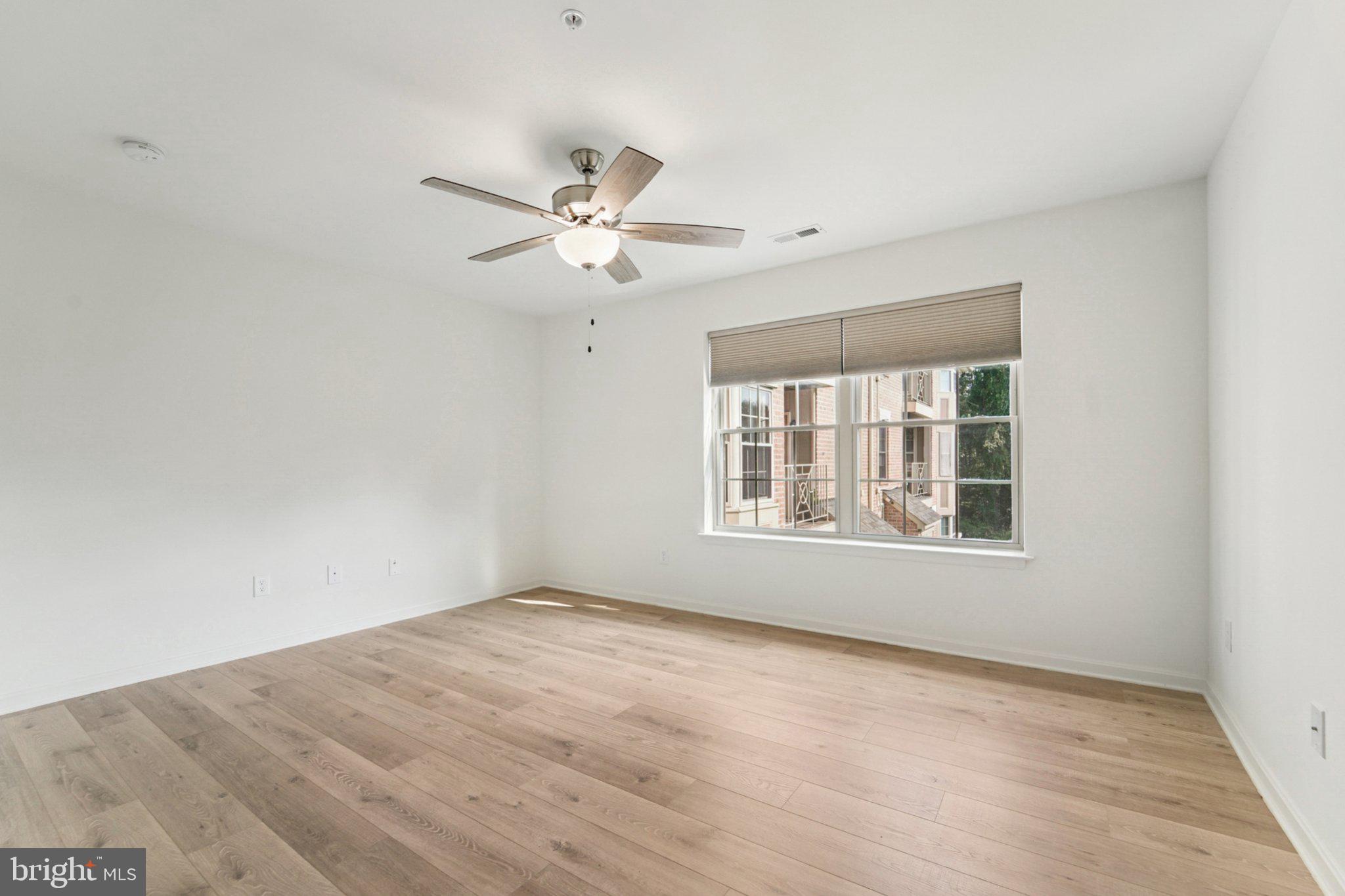 3500 Thomas Pointe Court, Unit 2B Abingdon, MD 21009 - Photo 20 of 37 an empty room with a window and a fan