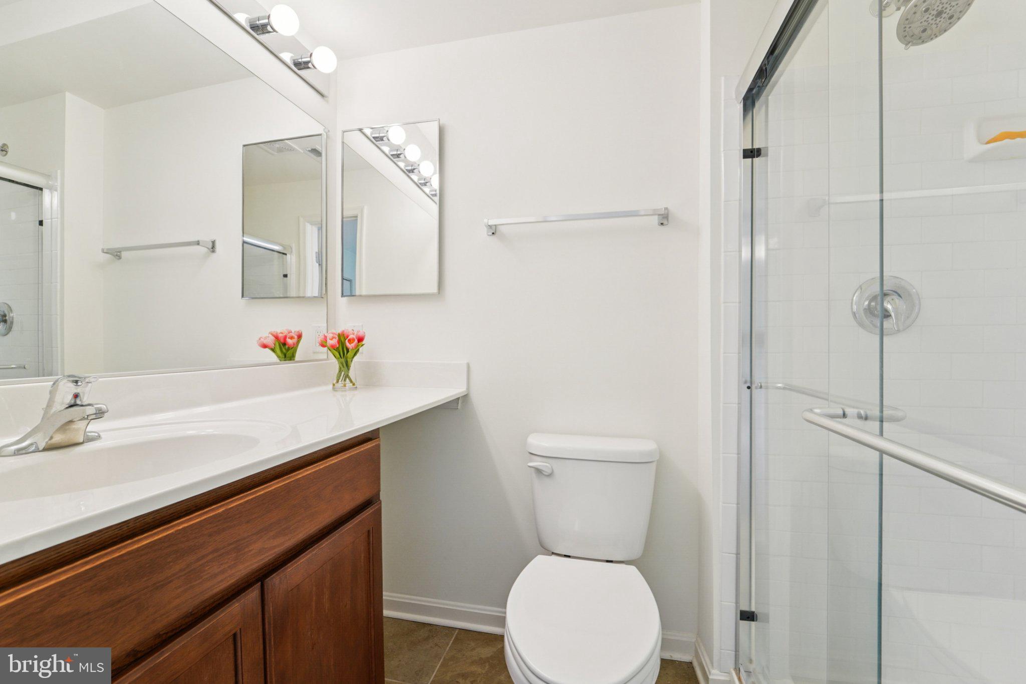 3500 Thomas Pointe Court, Unit 2B Abingdon, MD 21009 - Photo 21 of 37 a bathroom with a sink a toilet and shower