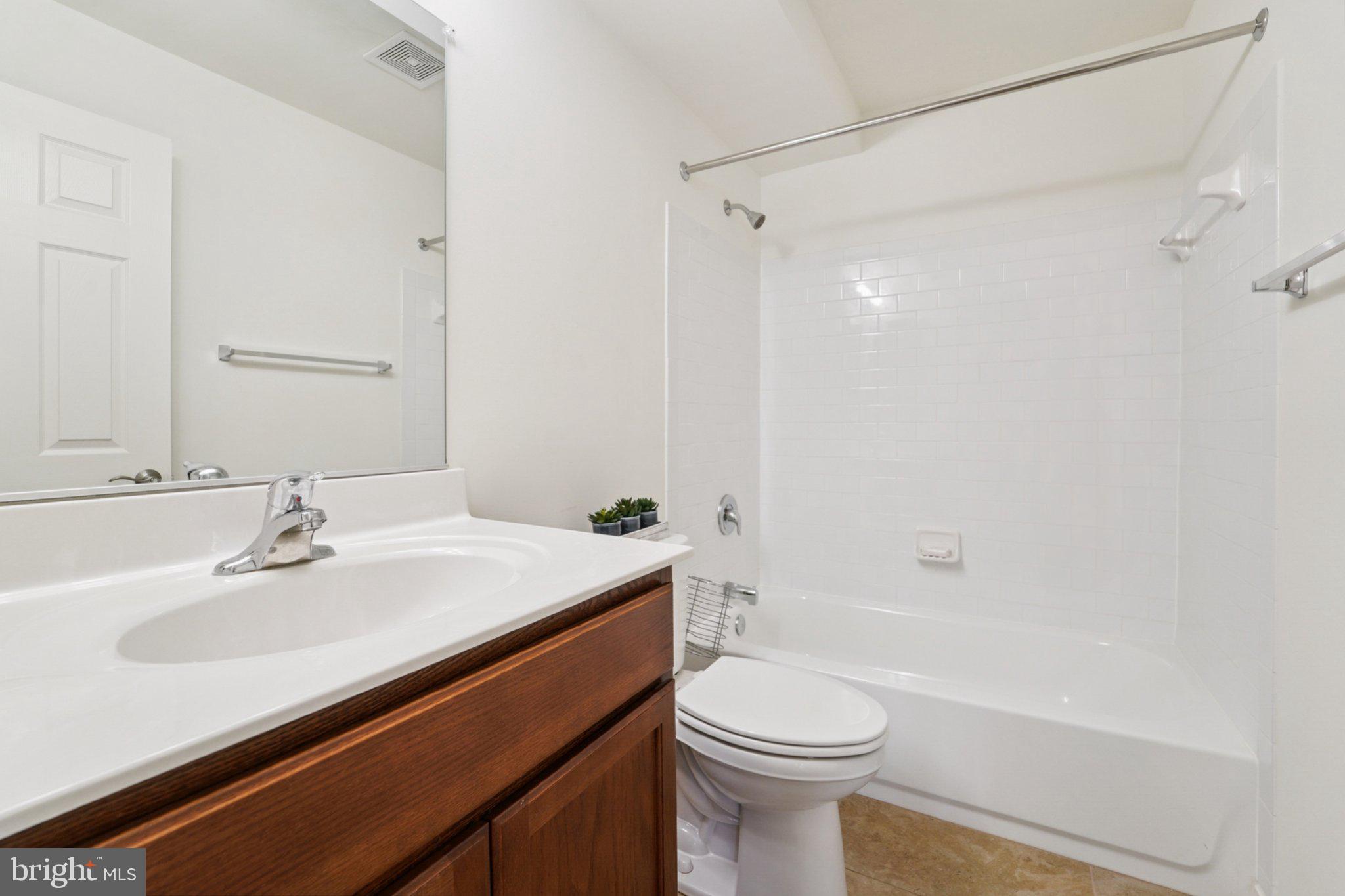 3500 Thomas Pointe Court, Unit 2B Abingdon, MD 21009 - Photo 24 of 37 a bathroom with a sink a toilet and shower