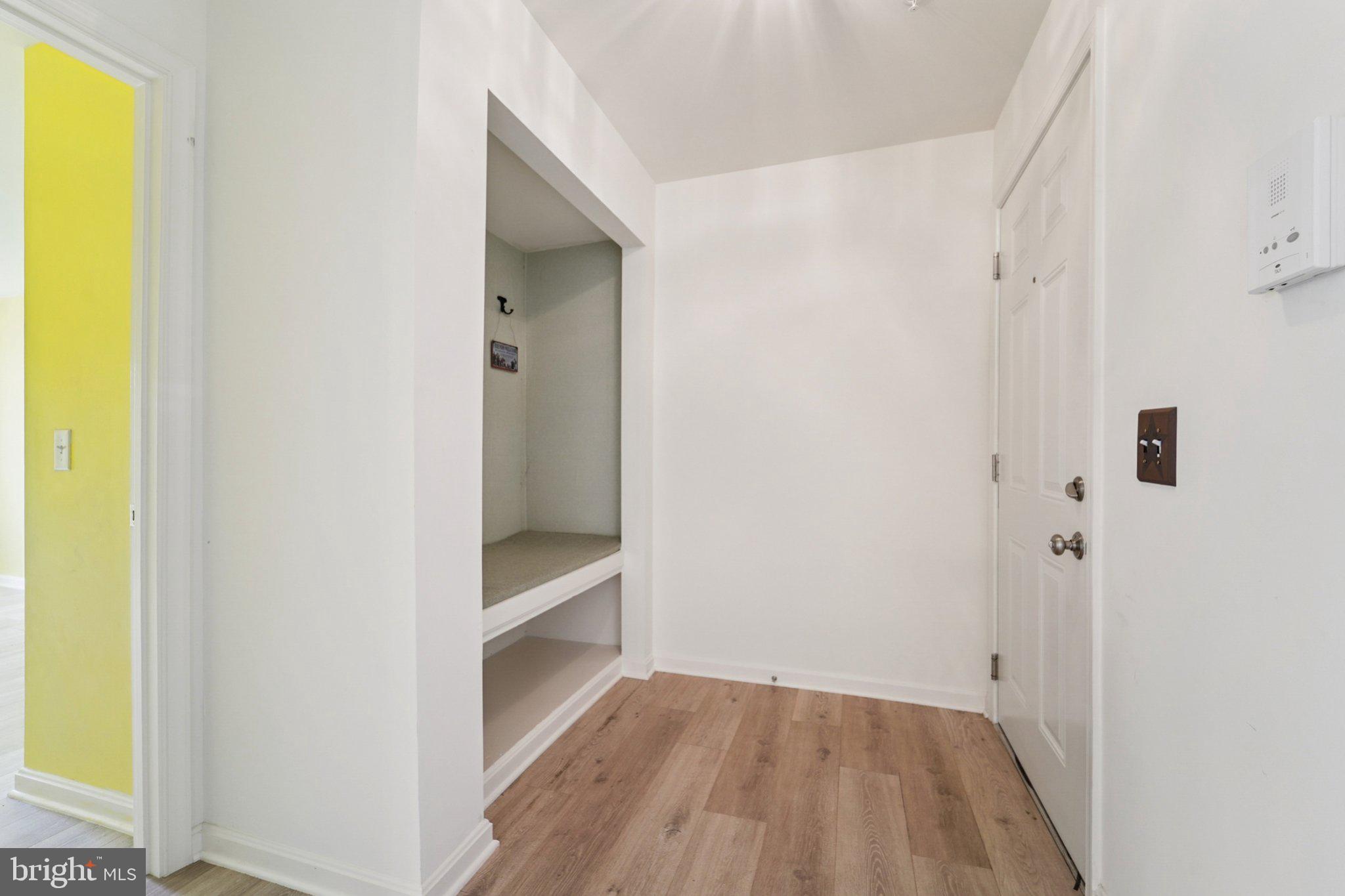 3500 Thomas Pointe Court, Unit 2B Abingdon, MD 21009 - Photo 3 of 37 a view of an empty room with closet and wooden floor