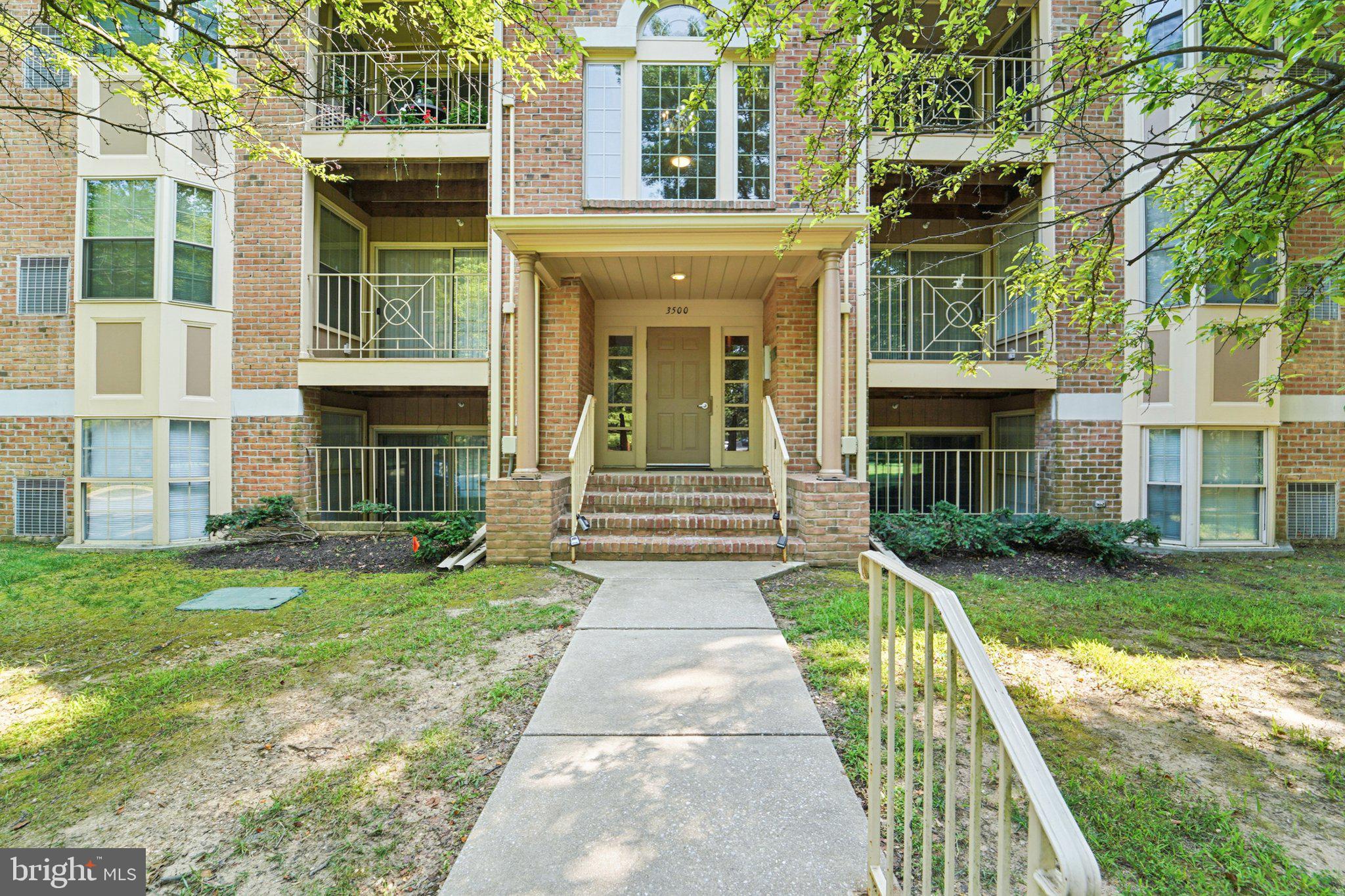 3500 Thomas Pointe Court, Unit 2B Abingdon, MD 21009 - Photo 33 of 37 a front view of a house with garden