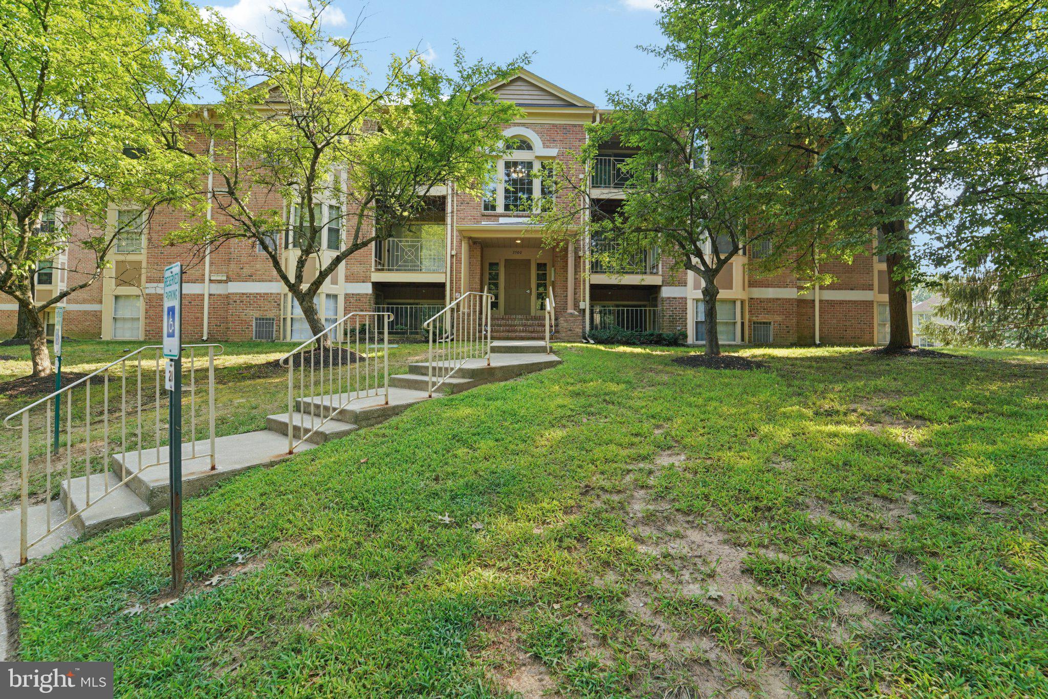 3500 Thomas Pointe Court, Unit 2B Abingdon, MD 21009 - Photo 36 of 37 a view of a house with a big yard and large trees