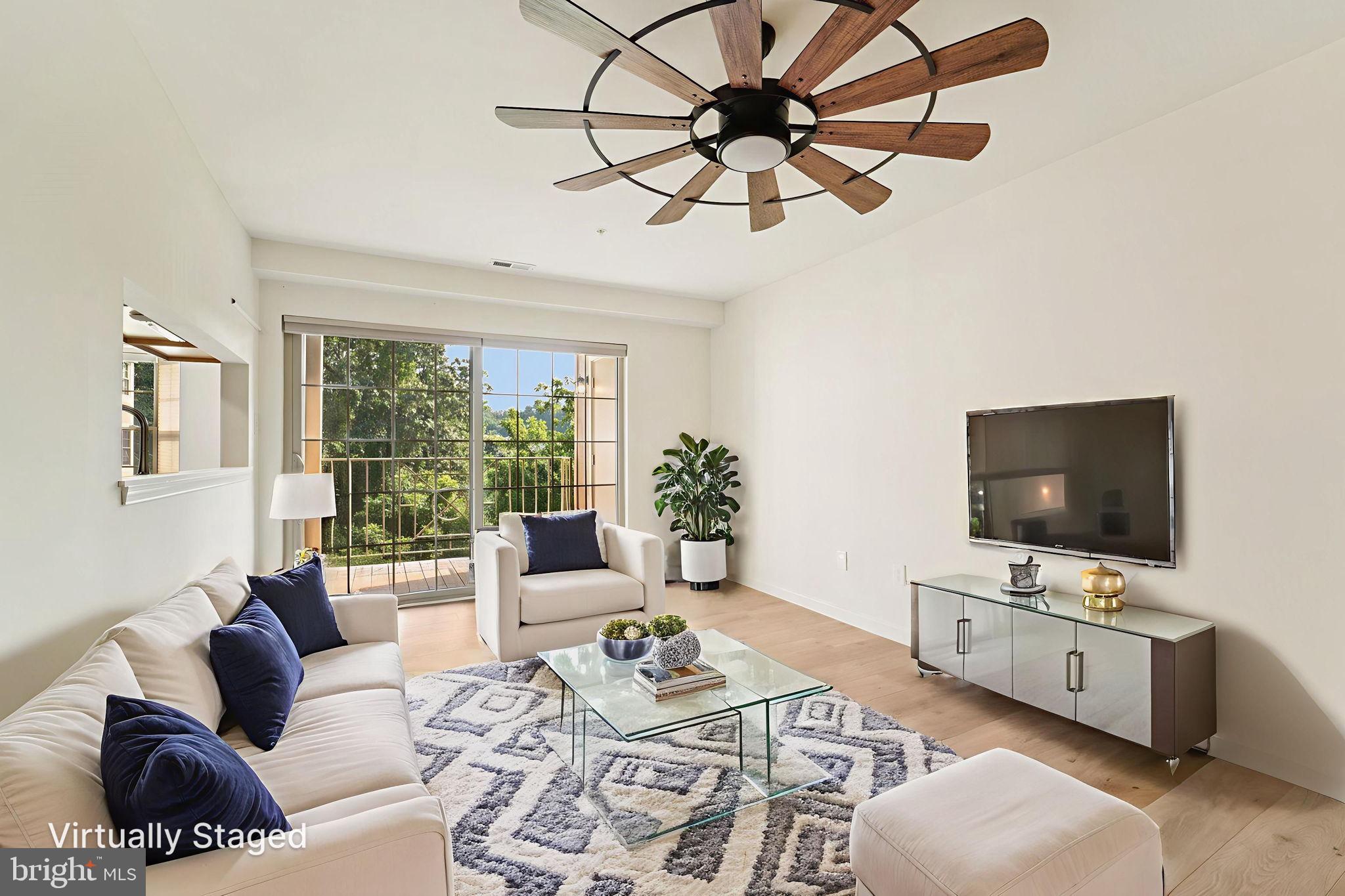 3500 Thomas Pointe Court, Unit 2B Abingdon, MD 21009 - Photo 4 of 37 a living room with furniture a flat screen tv and a window