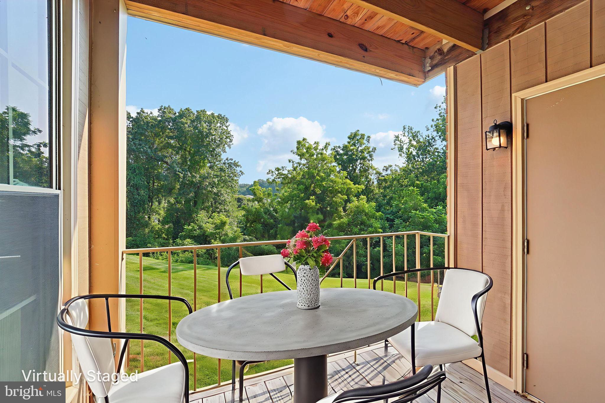 3500 Thomas Pointe Court, Unit 2B Abingdon, MD 21009 - Photo 7 of 37 a view of balcony with a dining table and chairs