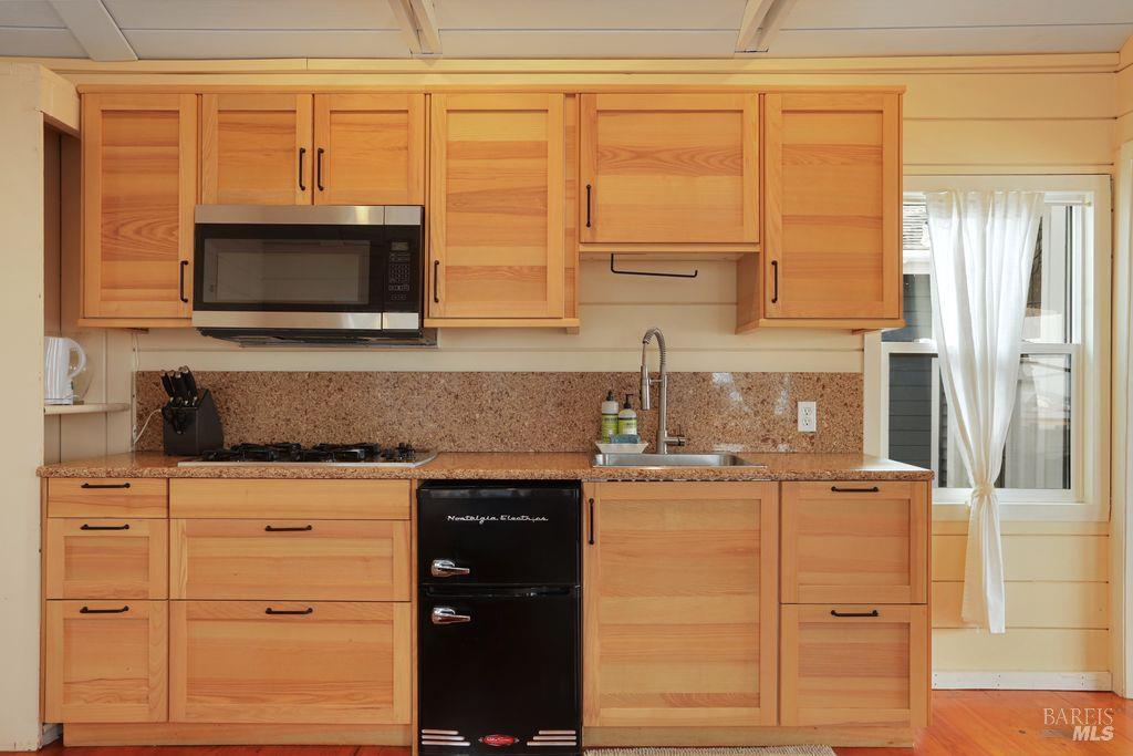 34 Sandy Beach Road Vallejo, CA 94590 - Photo 50 of 63 a kitchen with stainless steel appliances granite countertop a stove and a microwave