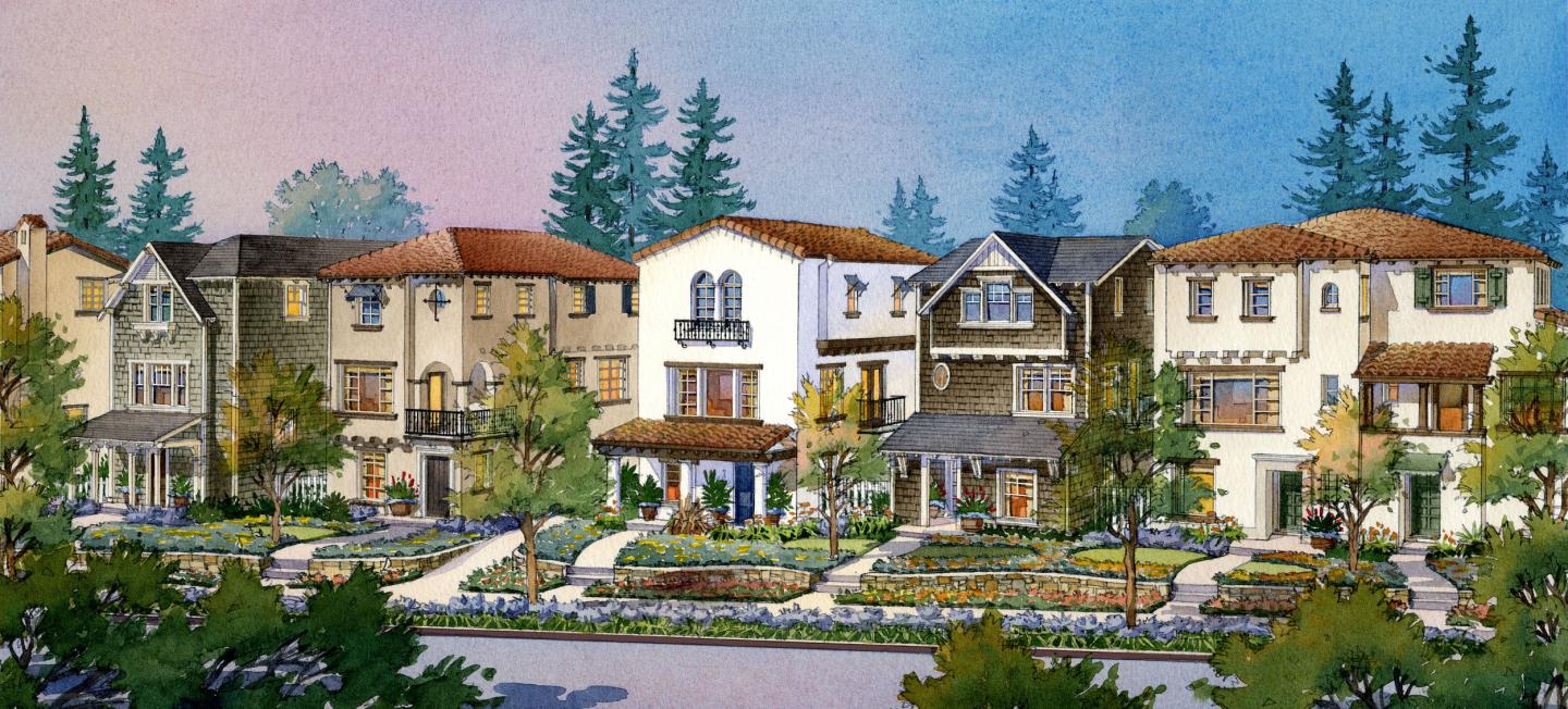 a front view of a residential apartment building with a yard