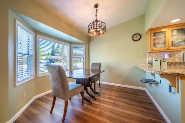 a kitchen with granite countertop a sink and cabinets