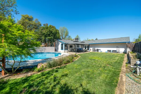 a view of a patio with chairs