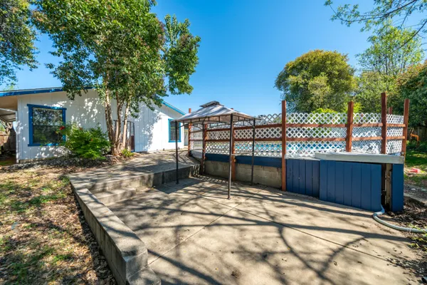 a view of outdoor space with deck and yard