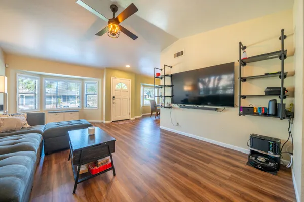 a living room with furniture and a flat screen tv