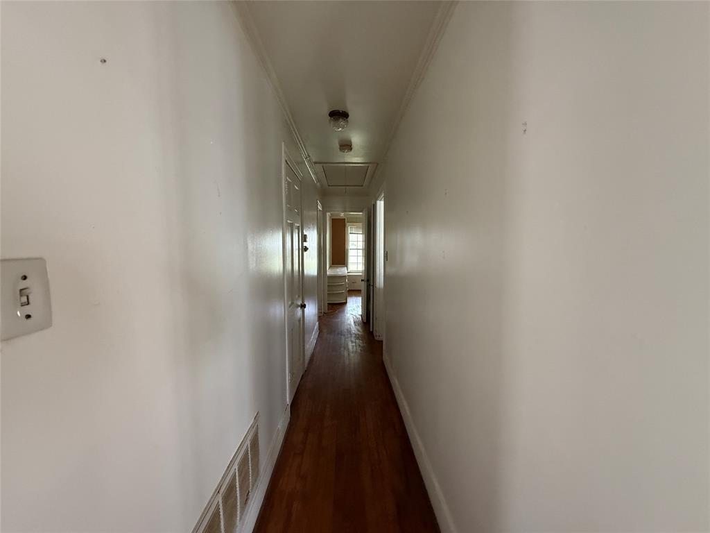 325 West 4th Street Tyler, TX 75701 - Photo 15 of 40 a view of a hallway with wooden floor