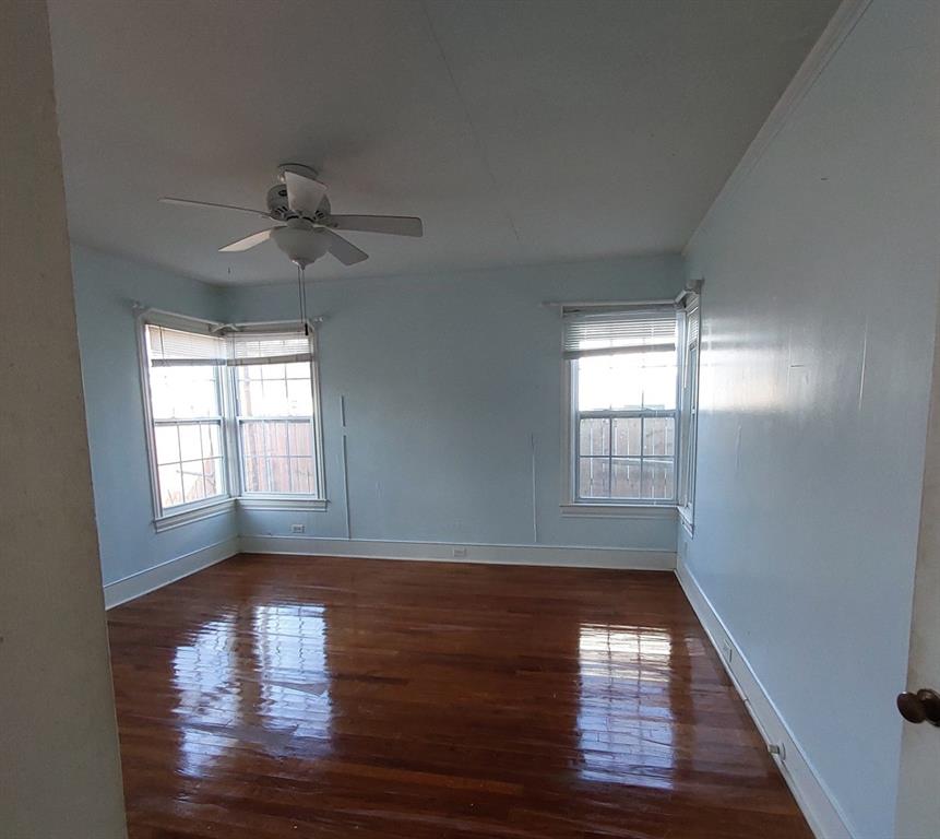 325 West 4th Street Tyler, TX 75701 - Photo 21 of 40 a view of empty room with wooden floor and fan