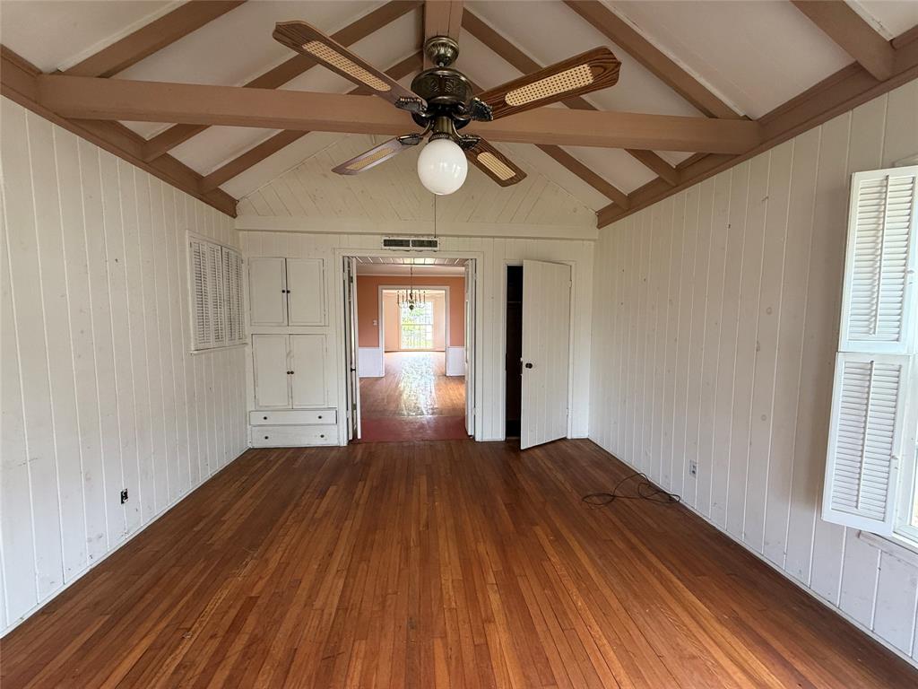 325 West 4th Street Tyler, TX 75701 - Photo 7 of 40 a view of an empty room with wooden floor and a window
