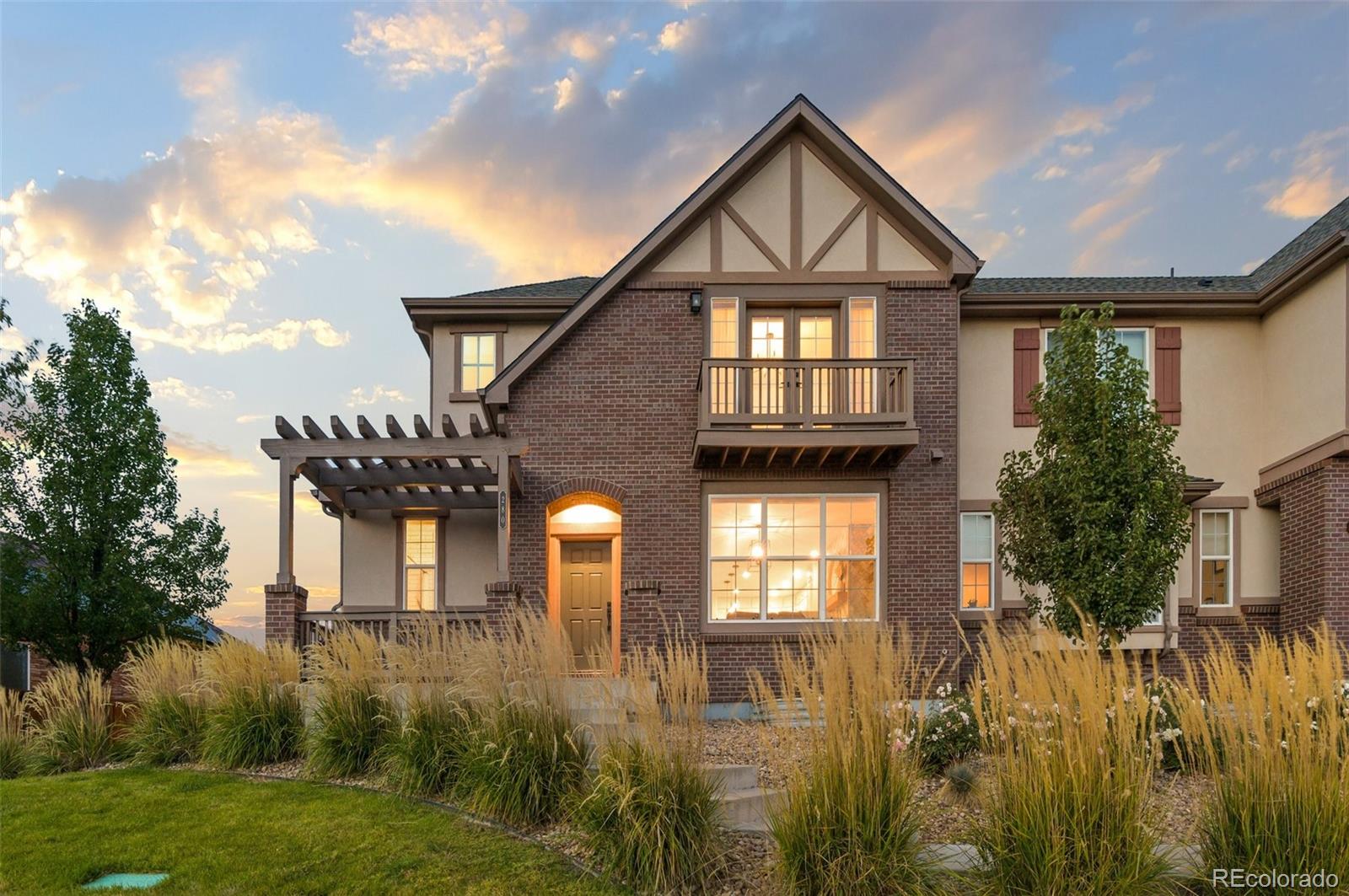 280 Yosemite Way Denver, CO 80230 - Photo 1 of 32 a front view of a house with a yard and lake view