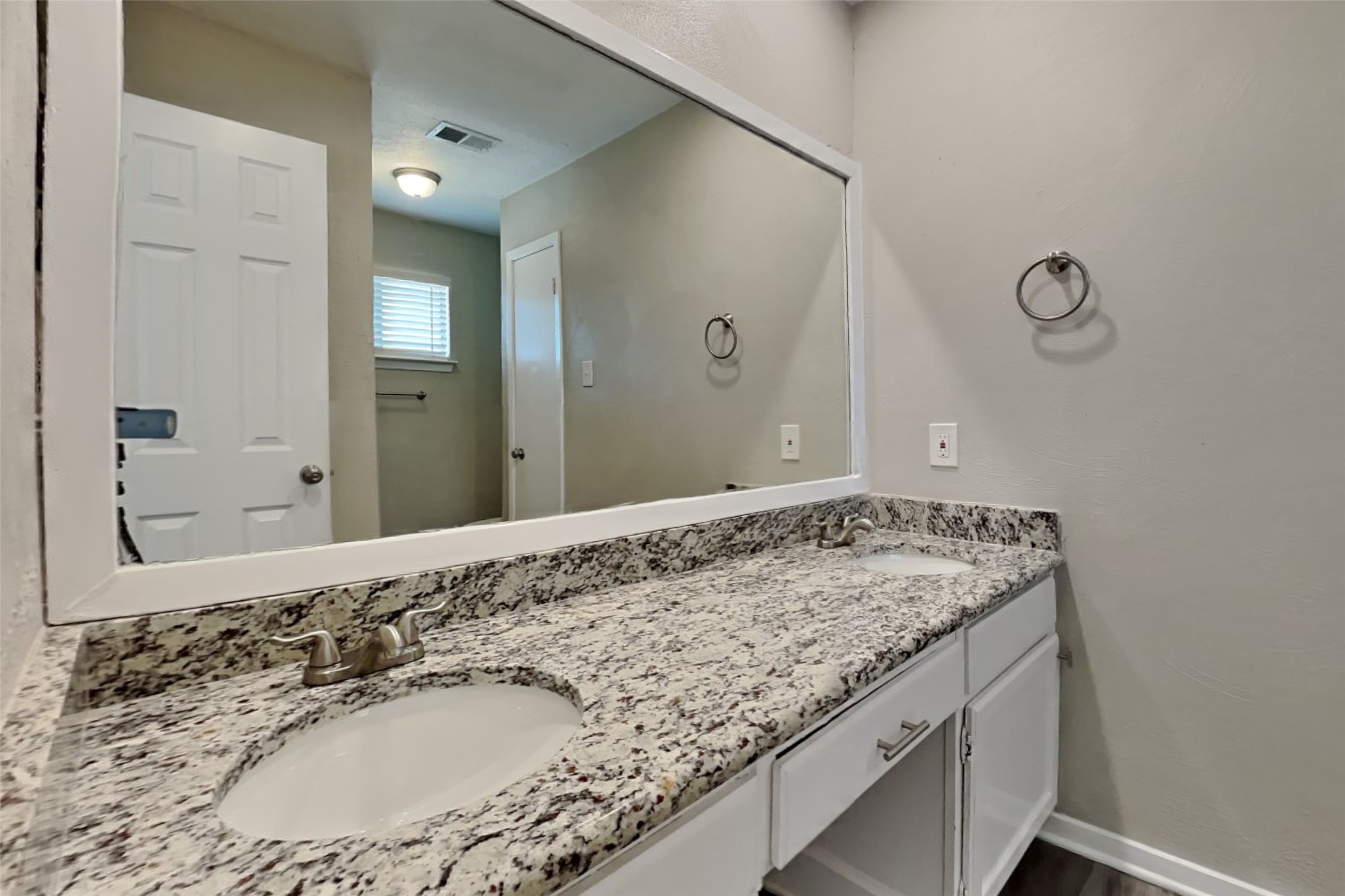 21606 Crescent Heights Street Spring, TX 77388 - Photo 14 of 23 a bathroom with a granite countertop sink and a mirror