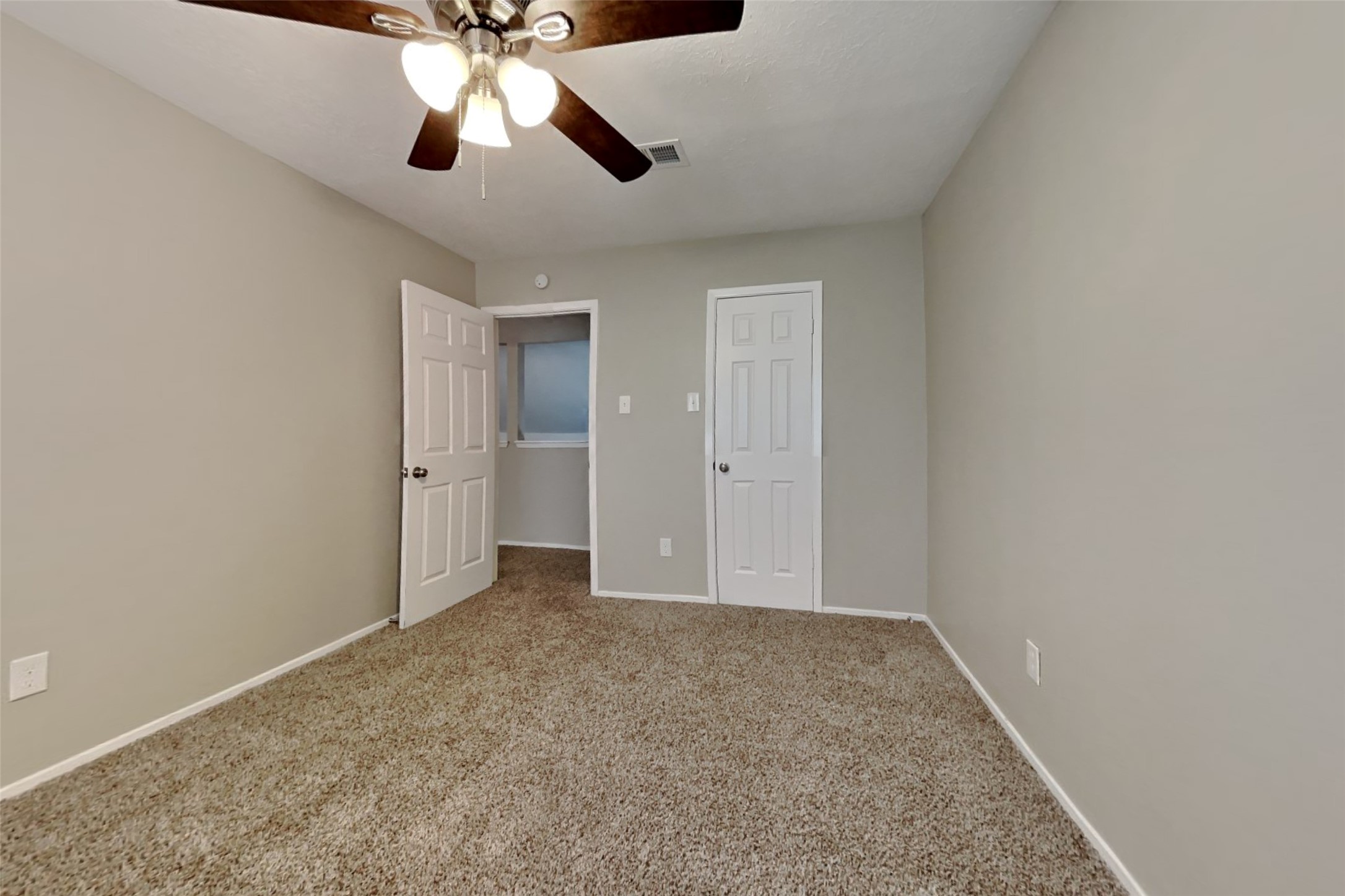 21606 Crescent Heights Street Spring, TX 77388 - Photo 16 of 23 an empty room with closet and chandelier fan