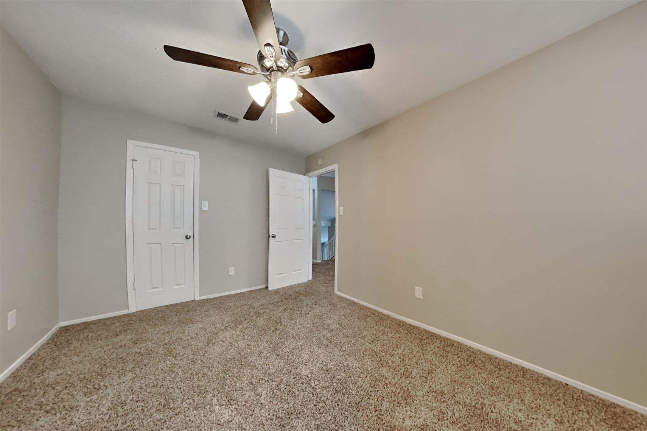 21606 Crescent Heights Street Spring, TX 77388 - Photo 18 of 23 a view of an empty room and chandelier fan