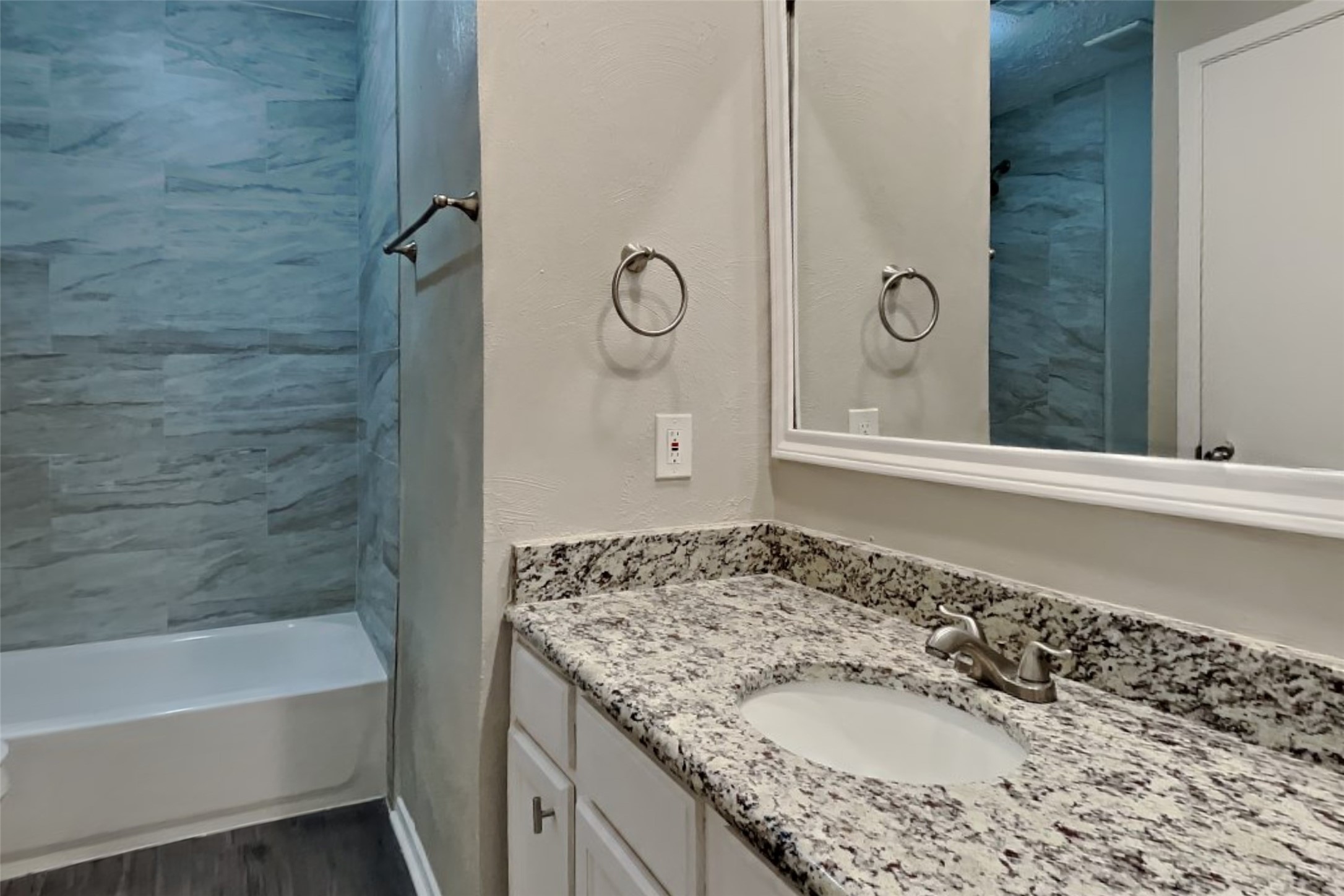 21606 Crescent Heights Street Spring, TX 77388 - Photo 19 of 23 a bathroom with a granite countertop sink and a mirror