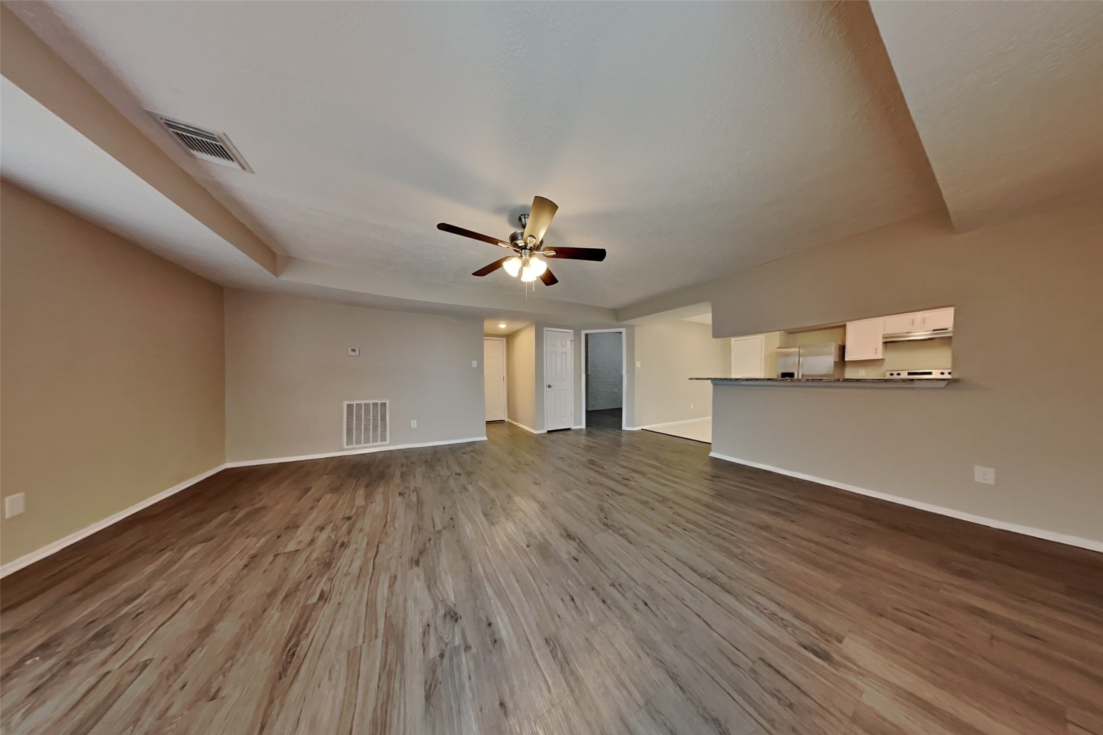 21606 Crescent Heights Street Spring, TX 77388 - Photo 6 of 23 wooden floor in an empty room with a window