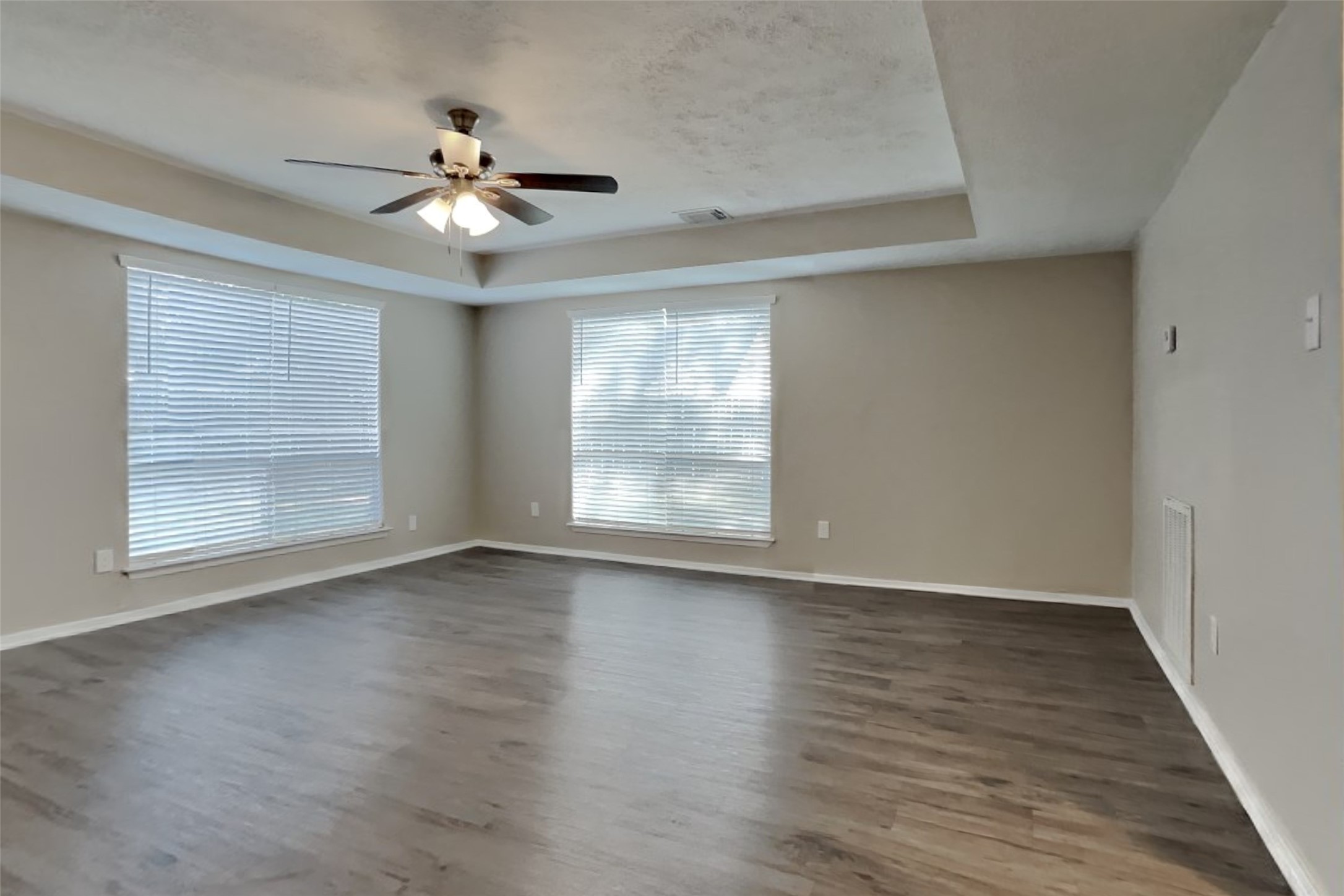 21606 Crescent Heights Street Spring, TX 77388 - Photo 7 of 23 a view of an empty room with wooden floor and a window