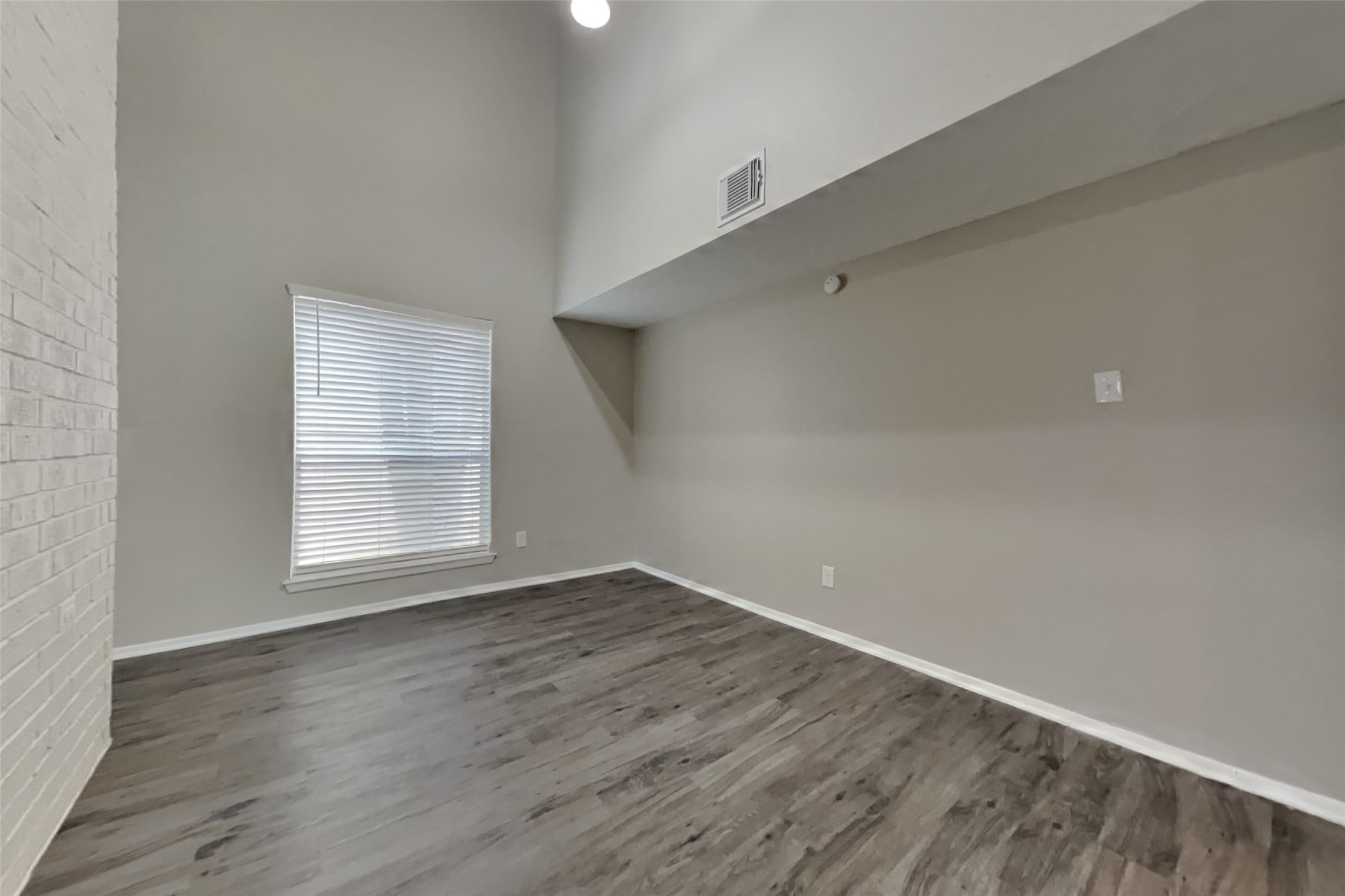 21606 Crescent Heights Street Spring, TX 77388 - Photo 10 of 23 an empty room with wooden floor and windows