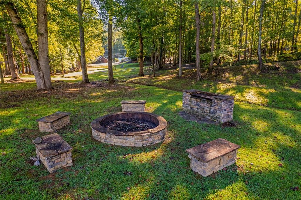 248 Stirratt Road Ranger, GA 30734 - Photo 20 of 24 a swimming pool with some trees and big trees
