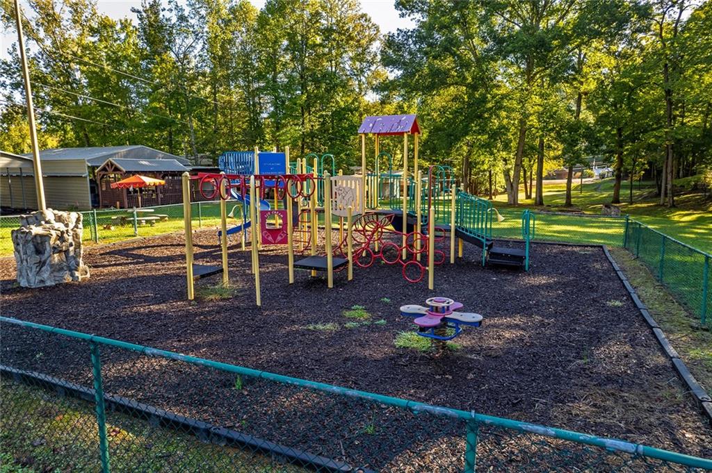 248 Stirratt Road Ranger, GA 30734 - Photo 21 of 24 a view of a park with chairs and a table