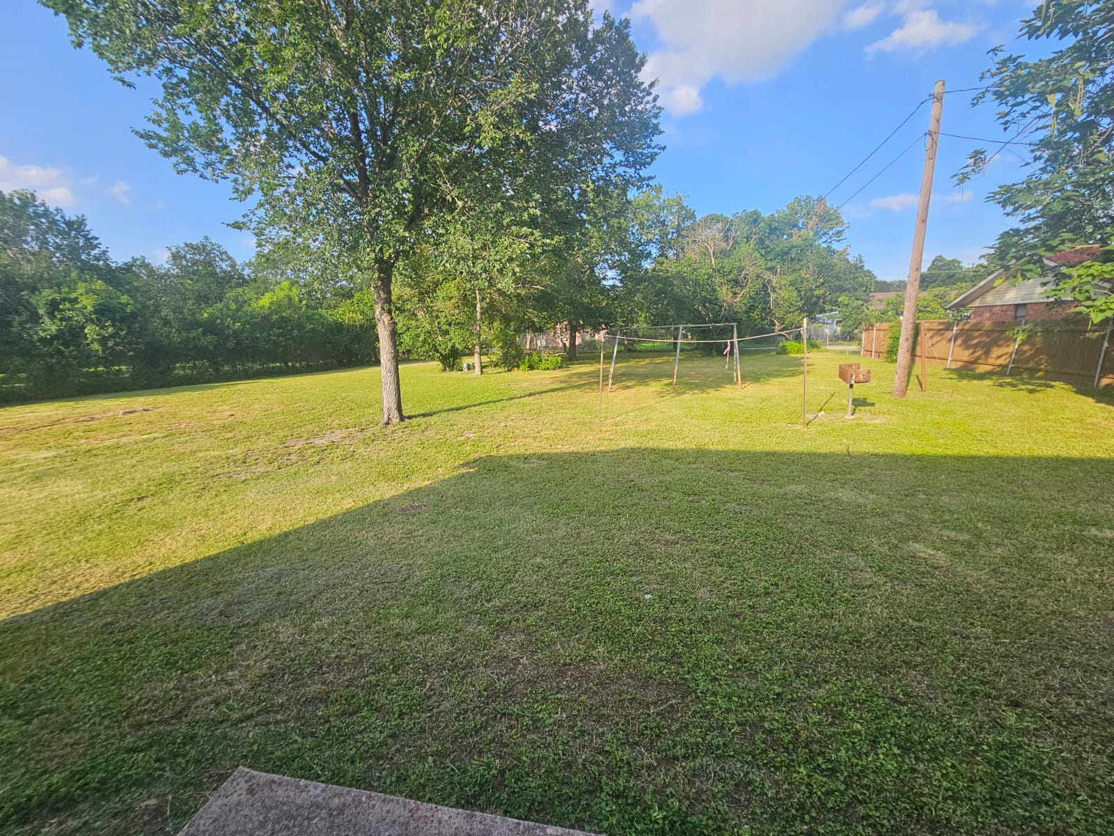 606 Trinity Street Lockhart, TX 78644 - Photo 22 of 23 A generously sized yard, perfect for outdoor activities and future landscaping visions.
