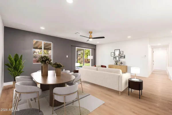 a living room with furniture and a table