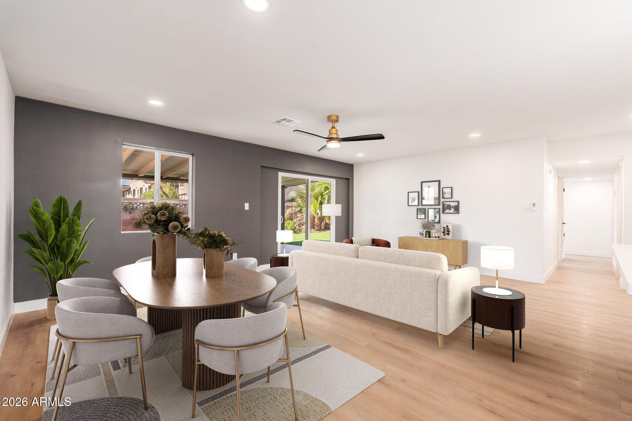 6134 North 9th Street Phoenix, AZ 85014 - Photo 11 of 36 a living room with furniture and a table